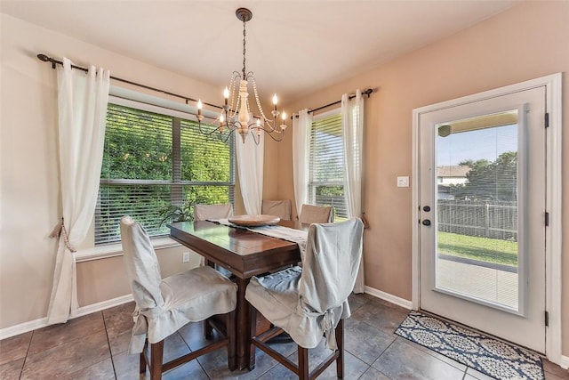 201 Tulip Trail Bnd, Cedar Park, TX 78613 - tiled dining space with a chandelier and baseboards