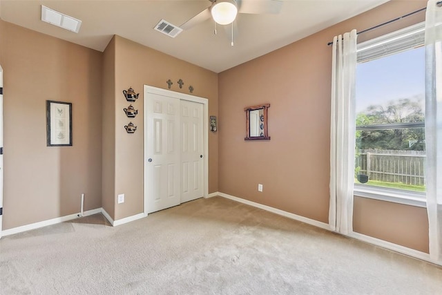 201 Tulip Trail Bnd, Cedar Park, TX 78613 - unfurnished bedroom with carpet flooring, baseboards, a closet, and a ceiling fan
