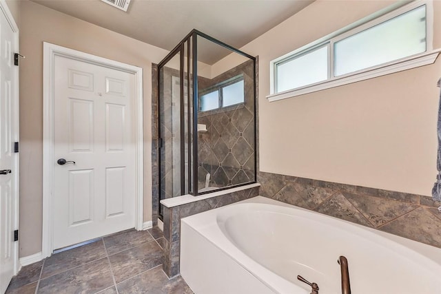 201 Tulip Trail Bnd, Cedar Park, TX 78613 - full bathroom featuring a garden tub, a stall shower, and baseboards