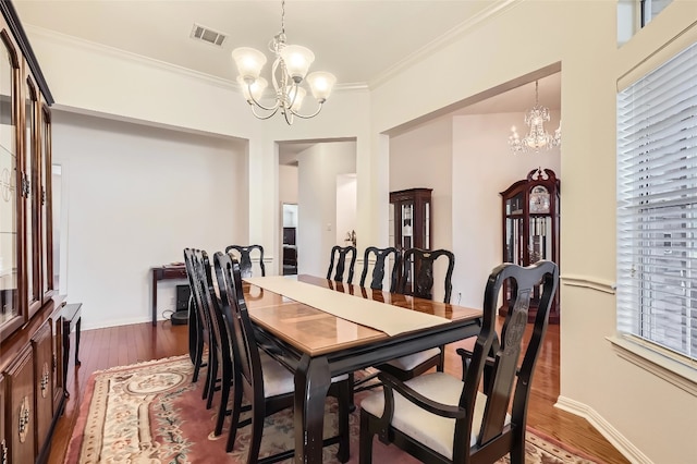 801 Lone Buck Pass, Cedar Park, TX 78613 - dining room with a chandelier, dark wood-style flooring, crown molding, and baseboards