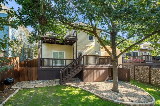 3608 S 2nd St, Austin, TX 78704 - rear view of property featuring a wooden deck, a balcony, and stairway
