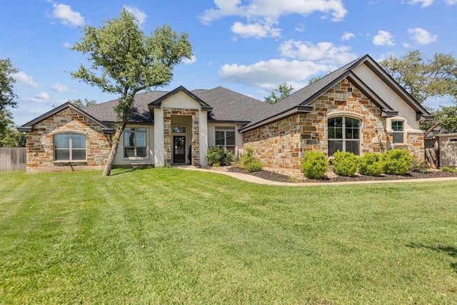 view of front of house with stone siding and roof with shingles