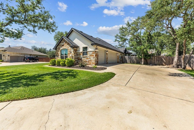 26 Riverstone Pkwy, Belton, TX 76513 - view of front of property with stone siding, an attached garage, stucco siding, and concrete driveway