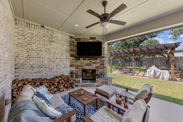 view of patio with an outdoor living space with a fireplace, a pergola, and ceiling fan