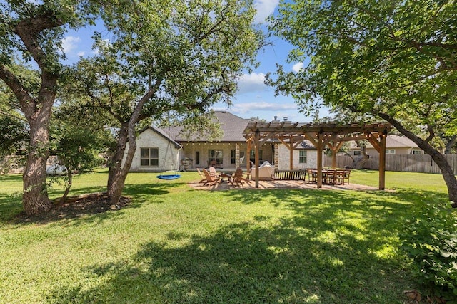 rear view of house featuring a pergola and a patio area