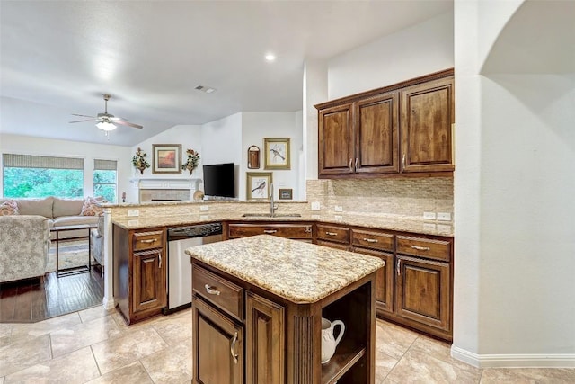 kitchen featuring dishwasher, a ceiling fan, open floor plan, a peninsula, and vaulted ceiling