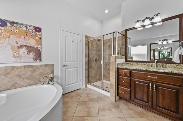 740 Harris Dr, Austin, TX 78737 - full bathroom featuring vanity, a bath, a shower stall, and tile patterned floors