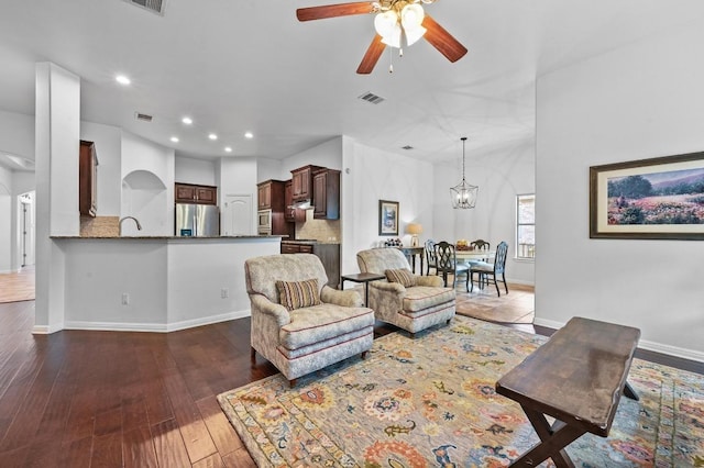 740 Harris Dr, Austin, TX 78737 - living area with a ceiling fan, wood-type flooring, arched walkways, recessed lighting, and a chandelier