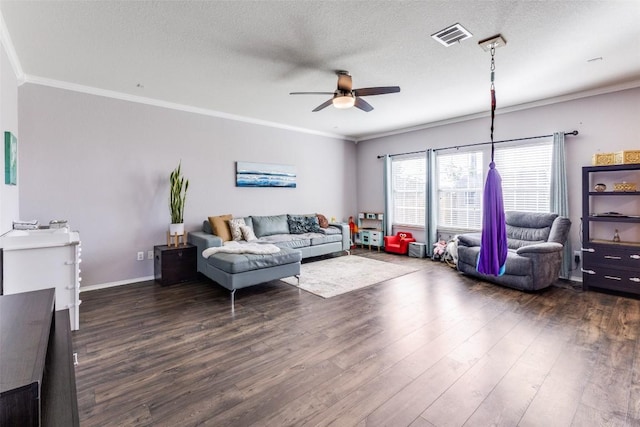 490 Holly Grove St, Kyle, TX 78640 - living area with ceiling fan, dark wood finished floors, ornamental molding, a textured ceiling, and baseboards