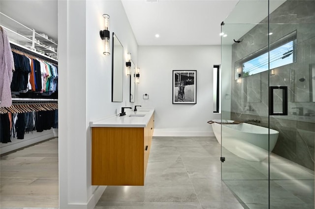 3305 Skylark Dr, Austin, TX 78757 - bathroom featuring baseboards, a stall shower, a freestanding tub, vanity, and a walk in closet