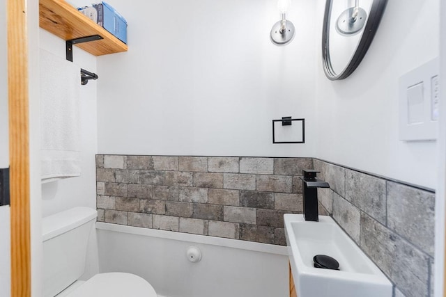 113 Woodland Rd, Georgetown, TX 78628 - half bathroom featuring a sink and toilet