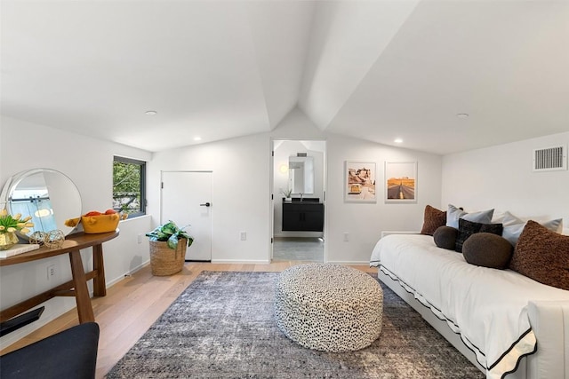 2502 Barhill Dr, Austin, TX 78704 - bedroom with light wood finished floors, vaulted ceiling, recessed lighting, and ensuite bathroom