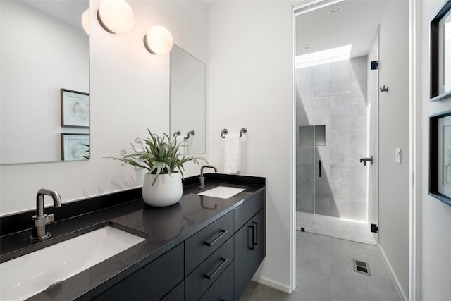 2502 Barhill Dr, Austin, TX 78704 - bathroom featuring double vanity, a shower stall, and tile patterned floors