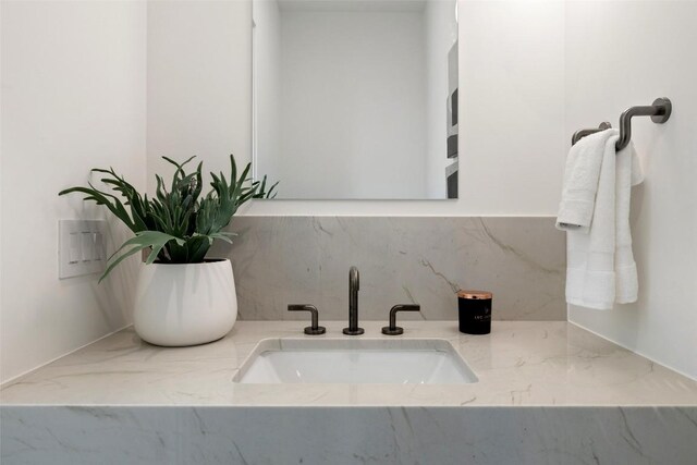 2502 Barhill Dr, Austin, TX 78704 - bathroom featuring tasteful backsplash and vanity