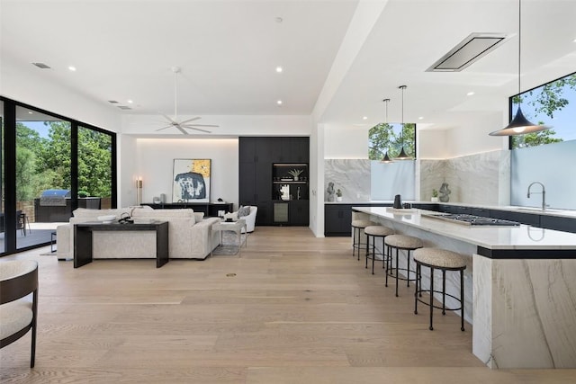 2502 Barhill Dr, Austin, TX 78704 - living area with light wood-type flooring, recessed lighting, and a ceiling fan