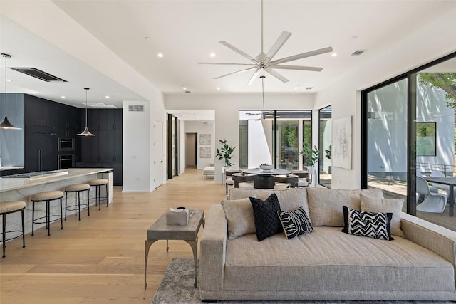 2502 Barhill Dr, Austin, TX 78704 - living area featuring light wood-style flooring, ceiling fan, and recessed lighting