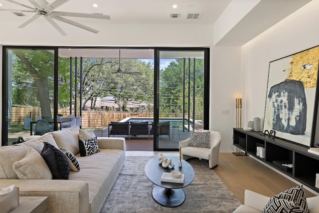 2502 Barhill Dr, Austin, TX 78704 - living area featuring wood finished floors, ceiling fan, and recessed lighting