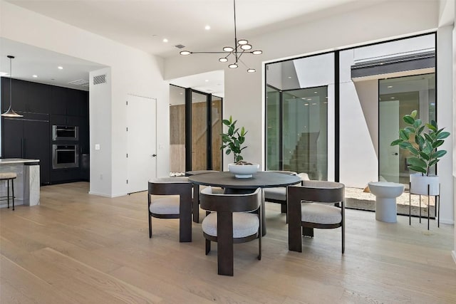 2502 Barhill Dr, Austin, TX 78704 - dining room with light wood finished floors and recessed lighting