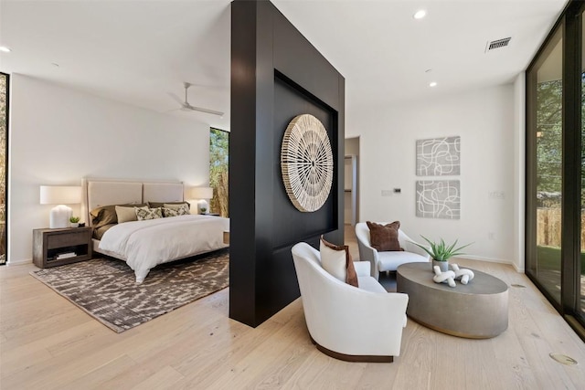 2502 Barhill Dr, Austin, TX 78704 - bedroom with multiple windows, light wood-style floors, access to outside, and recessed lighting