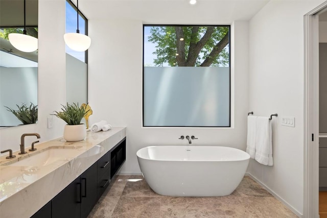 2502 Barhill Dr, Austin, TX 78704 - bathroom with vanity, a freestanding tub, and a wall of windows