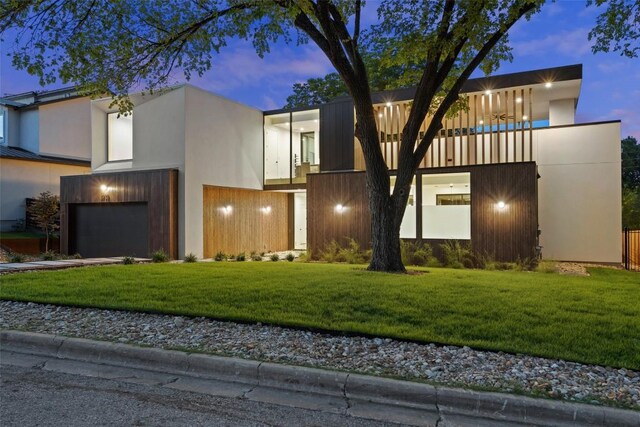 2502 Barhill Dr, Austin, TX 78704 - modern home with a garage, stucco siding, a front lawn, and driveway