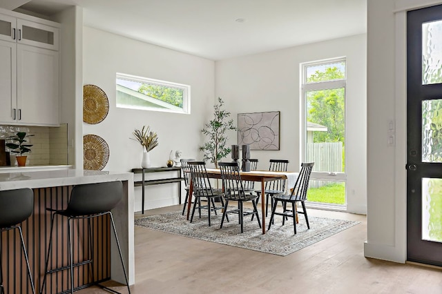 dining area with light wood-style floors
