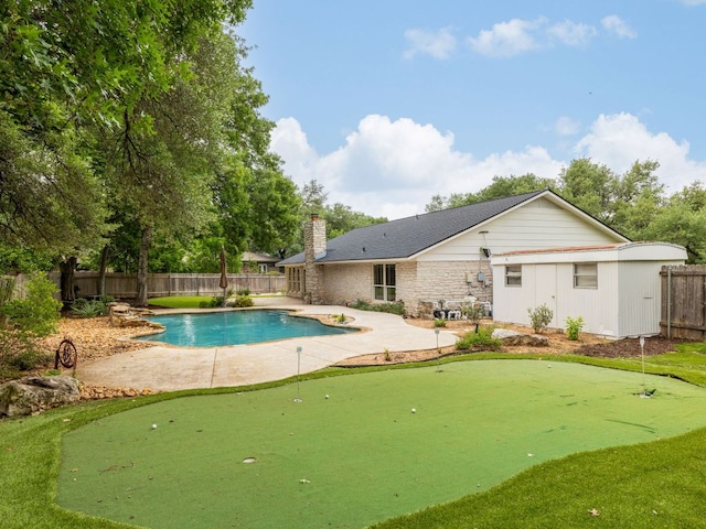 504 Ridgecrest Rd, Georgetown, TX 78628 - view of swimming pool featuring a putting green, a patio area, and a fenced backyard