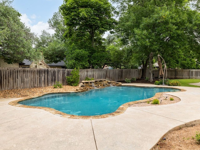view of swimming pool with a fenced backyard and a patio