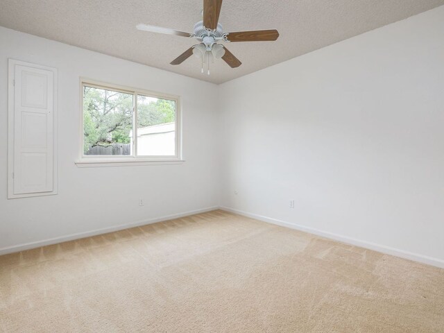 504 Ridgecrest Rd, Georgetown, TX 78628 - unfurnished room featuring light carpet, a ceiling fan, and a textured ceiling