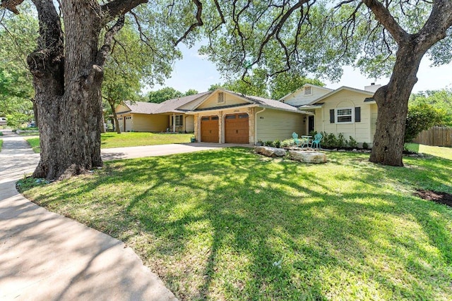 4806 Transit Cir, Austin, TX 78727 - ranch-style home featuring an attached garage and driveway