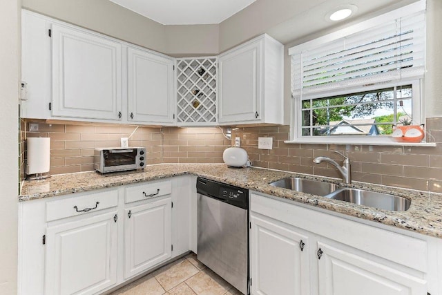 4806 Transit Cir, Austin, TX 78727 - kitchen with dishwasher, a sink, and white cabinets