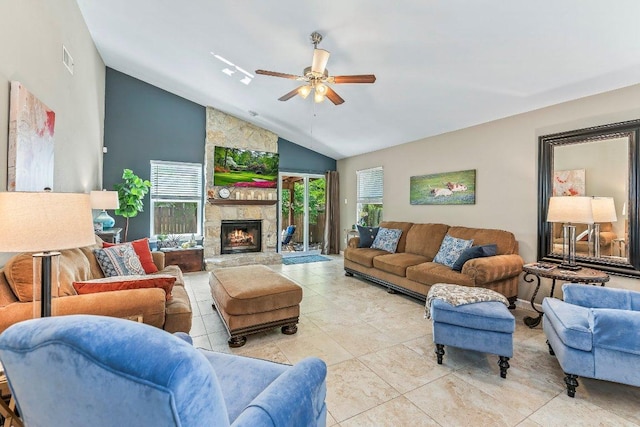 4806 Transit Cir, Austin, TX 78727 - living area featuring vaulted ceiling, a ceiling fan, light tile patterned floors, and a fireplace