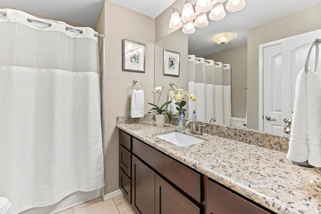4806 Transit Cir, Austin, TX 78727 - full bathroom with toilet, vanity, and tile patterned floors