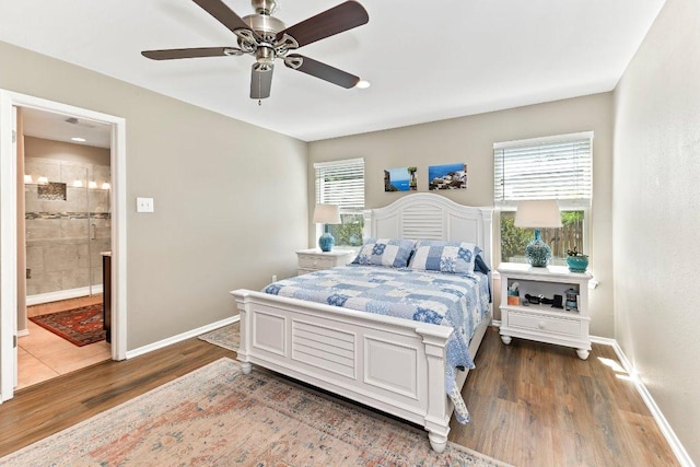 4806 Transit Cir, Austin, TX 78727 - bedroom with wood finished floors, ensuite bathroom, baseboards, and a ceiling fan