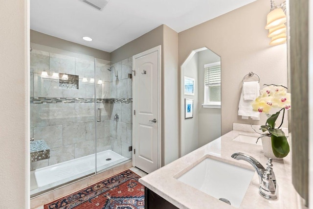 4806 Transit Cir, Austin, TX 78727 - bathroom with double vanity, a stall shower, and recessed lighting