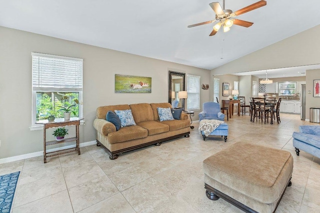 4806 Transit Cir, Austin, TX 78727 - living room with baseboards, ceiling fan, lofted ceiling, and light tile patterned flooring