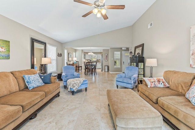 4806 Transit Cir, Austin, TX 78727 - living room with ceiling fan, vaulted ceiling, and light tile patterned floors