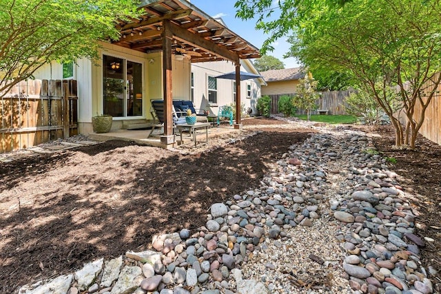 4806 Transit Cir, Austin, TX 78727 - fenced backyard with a pergola, a patio area, and ceiling fan