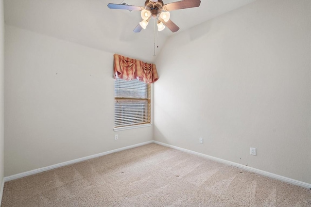 spare room featuring carpet, baseboards, and a ceiling fan