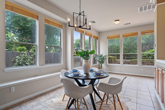 sunroom / solarium with baseboards and healthy amount of natural light