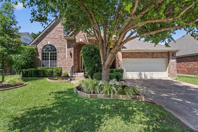 view of front of house with brick siding, concrete driveway, a front yard, and a garage