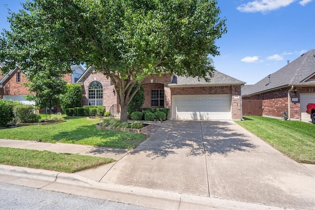 obstructed view of property with driveway, an attached garage, and brick siding