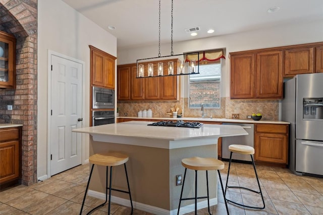 kitchen with stainless steel appliances, brown cabinets, a breakfast bar, light tile patterned flooring, and recessed lighting