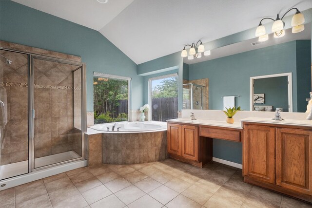 full bath featuring a bath, a shower stall, tile patterned floors, lofted ceiling, and double vanity