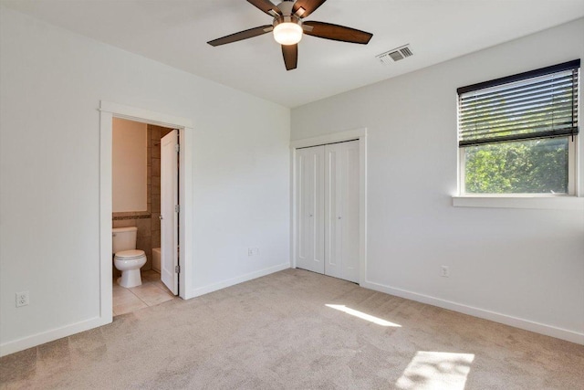 1305 Casey St Unit A, Austin, TX 78745 - unfurnished bedroom with carpet floors, a closet, ensuite bathroom, and a ceiling fan