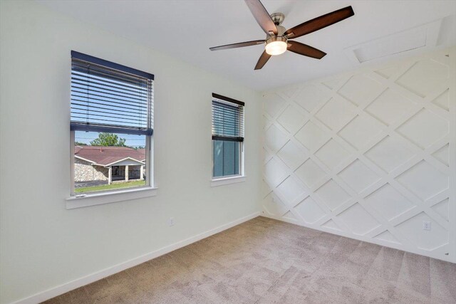 1305 Casey St Unit A, Austin, TX 78745 - carpeted spare room featuring a ceiling fan and attic access
