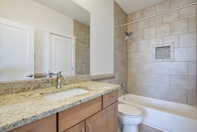 full bath featuring bathing tub / shower combination, toilet, and vanity