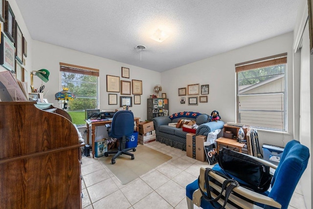 3108 W Terrace Dr, Austin, TX 78757 - office featuring healthy amount of natural light, light tile patterned flooring, and a textured ceiling