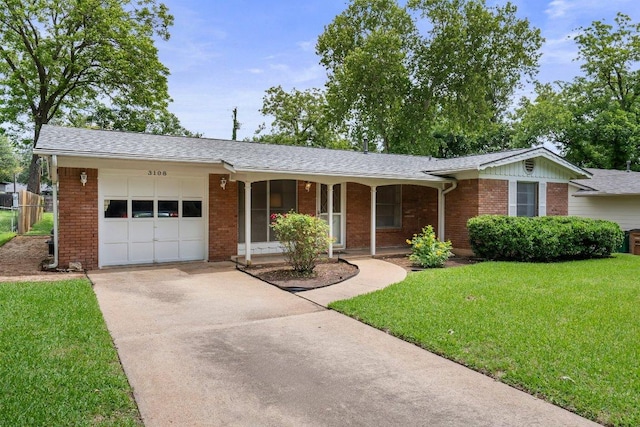 3108 W Terrace Dr, Austin, TX 78757 - ranch-style house with a garage, driveway, brick siding, a front yard, and covered porch