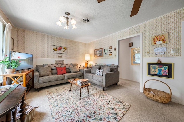 3108 W Terrace Dr, Austin, TX 78757 - carpeted living room featuring wallpapered walls, a chandelier, a ceiling fan, and a textured ceiling